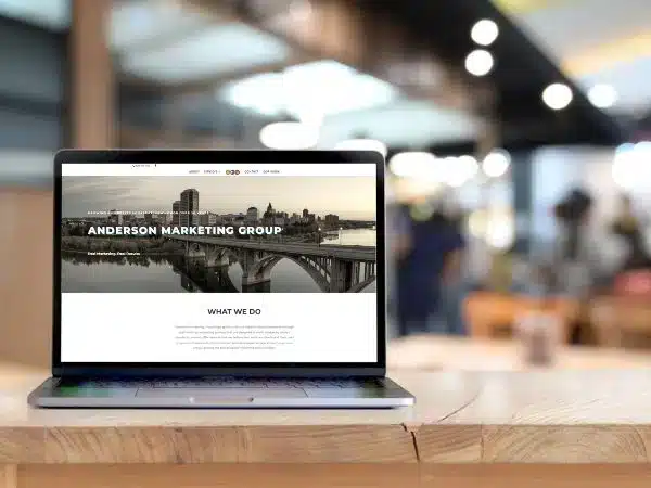 laptop displaying Anderson Marketing Group website